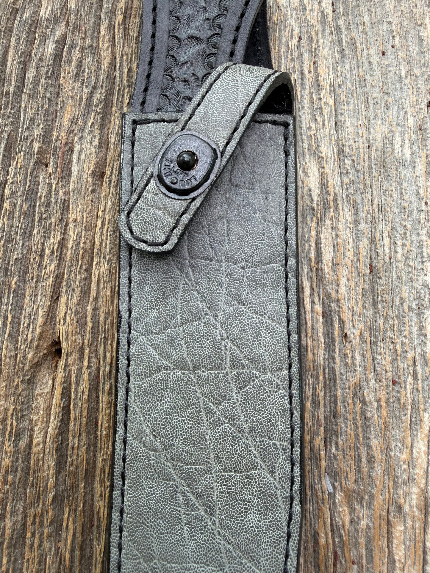 New Randall Model 1-8 Sheath in Exotic thick and textured Grey Elephant Hide on black leather from Treeman with a black Canteen snap. Hand tooled belt loop. Killer sheath.
