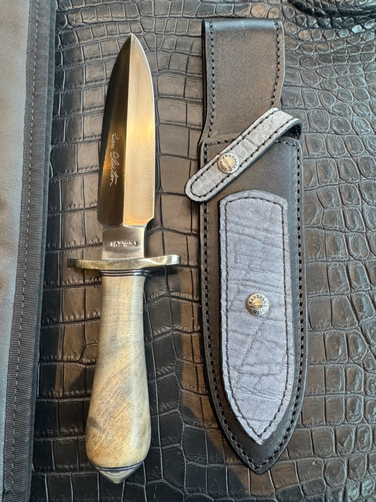 Randall Tom Clinton Dealer Special. Clinton Blade etched Commemorative 1/100 in a nice piece of Walnut. Very cool matching Elephant Gutcher sheath. Nickel Silver Hilt and Aluminum Coolie Butt cap. Included in black facsimile Tom Clinton case.