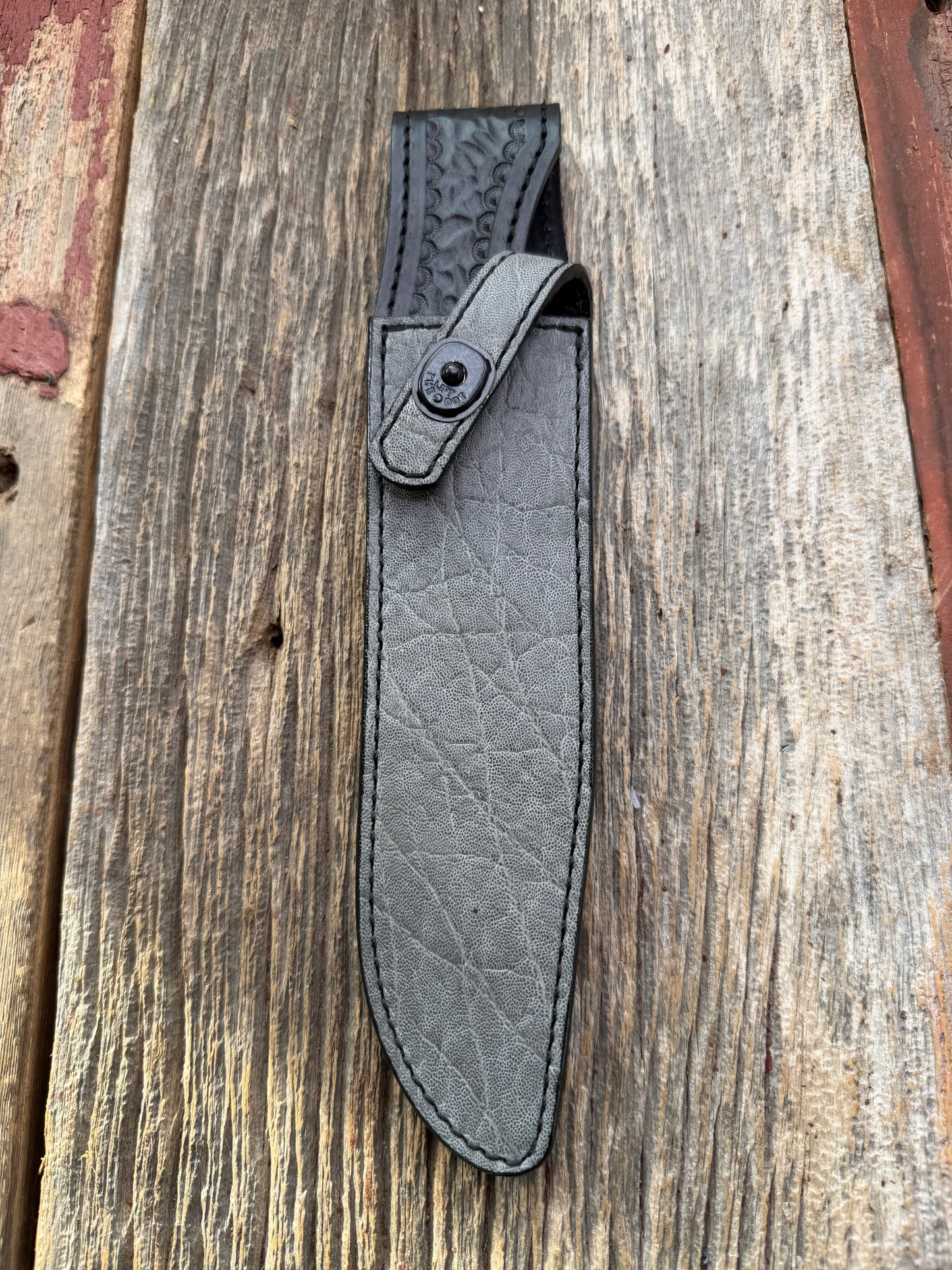 New Randall Model 1-8 Sheath in Exotic thick and textured Grey Elephant Hide on black leather from Treeman with a black Canteen snap. Hand tooled belt loop. Killer sheath.