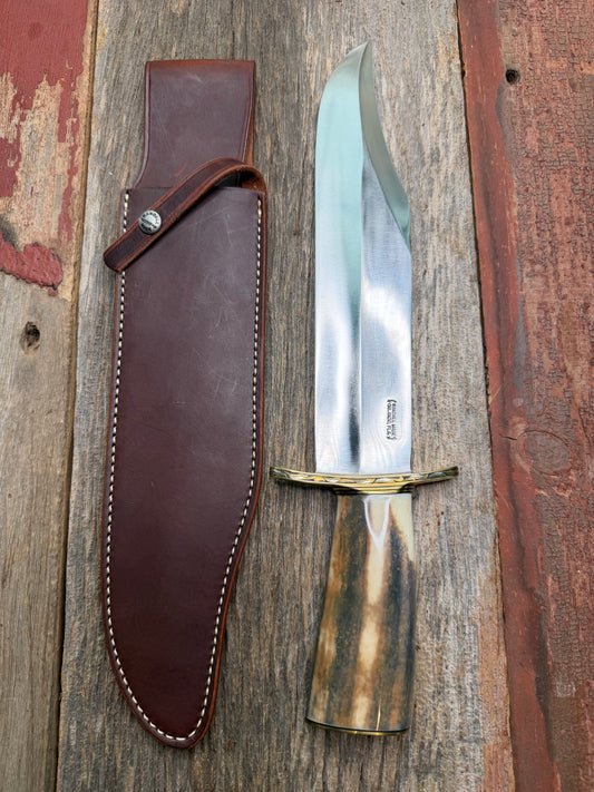 Randall Model 12-11 Smithsonian “Smitty” in a Huge piece of Green, Brown and Blue Fossil Walrus Ivory. Brass Hilt and Brass Butt plate fully engraved in Silver from Jere Davidson.  Stunning piece.