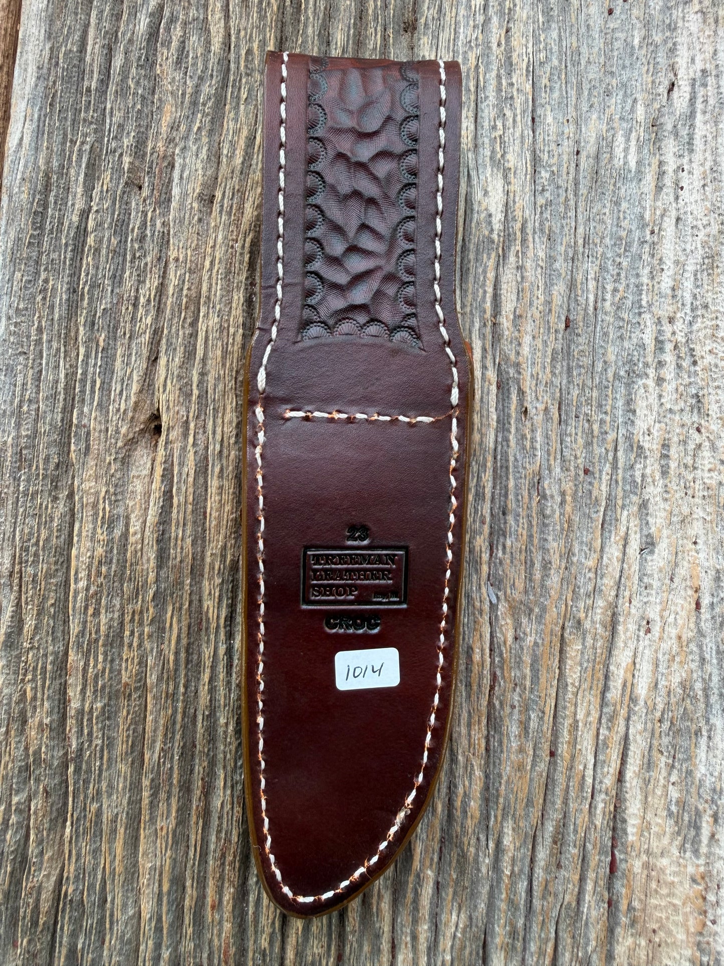 New Randall Model 23 Sheath in Exotic thick and textured Honey Crocodile skin on brown leather from Treeman with a silver Canteen snap. Hand tooled belt loop. Killer sheath.