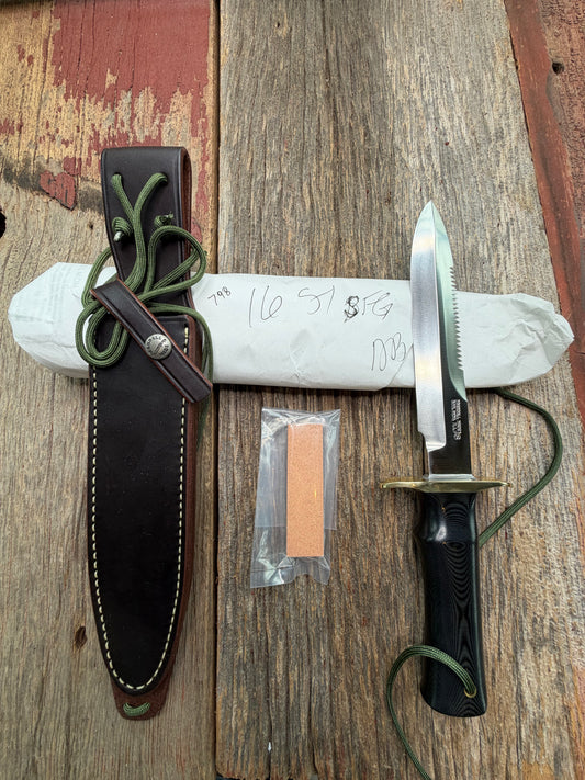 New in Paper Randall Model 16-7 Diver with a Black Micarta handle, Single finger grip , SS blade, Brass hilt, Sawteeth, Lanyard, Brown leather waxed sheath.