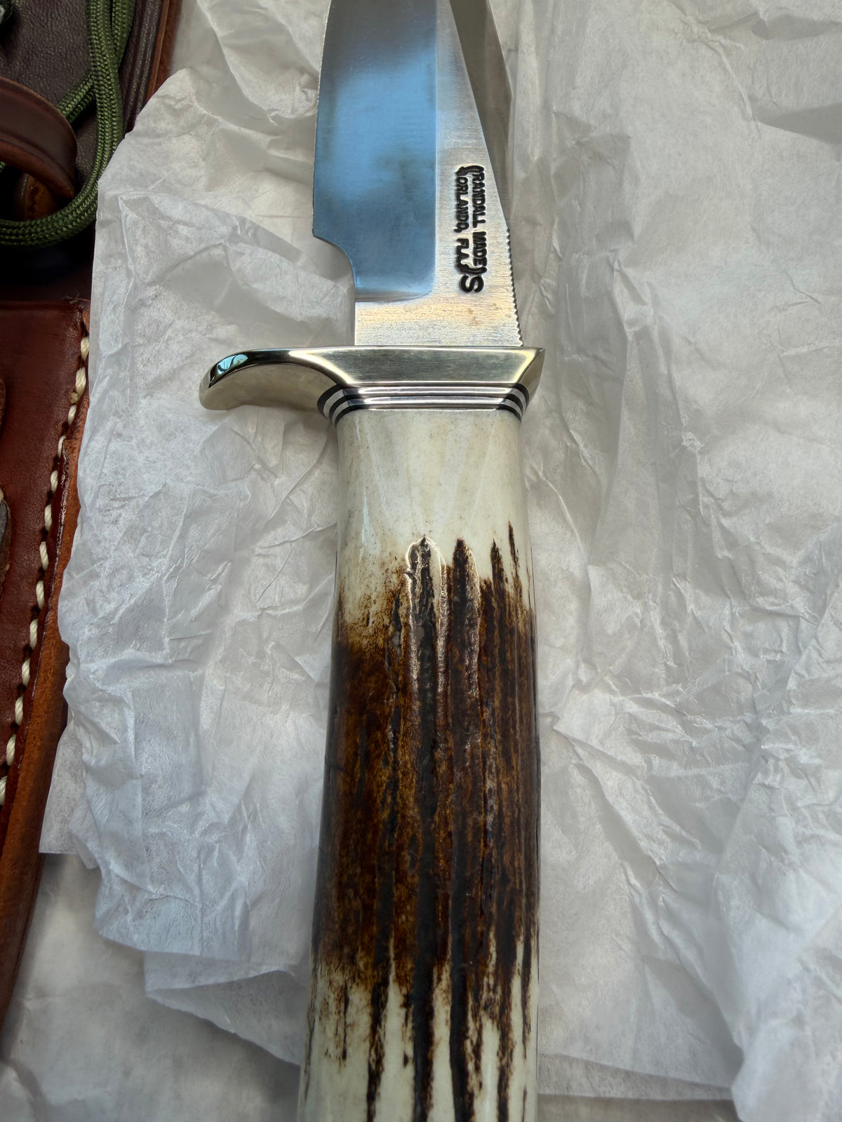 New in paper Randall Model 23 Game Master in a nice fat piece of Stag. Stainless steel blade, Nickel silver hilt, Black and Aluminum spacers and Brown leather sheath.
