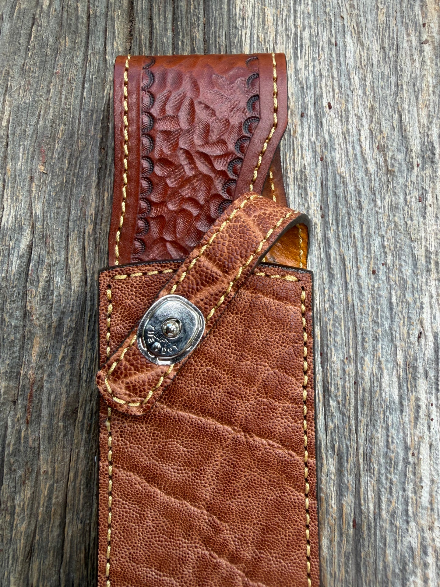 New Randall Model 12-11 Confederate Sheath in Exotic thick and textured Rust colored Elephant hide on brown leather from Treeman with a silver Canteen snap. Hand tooled belt loop. Killer sheath.