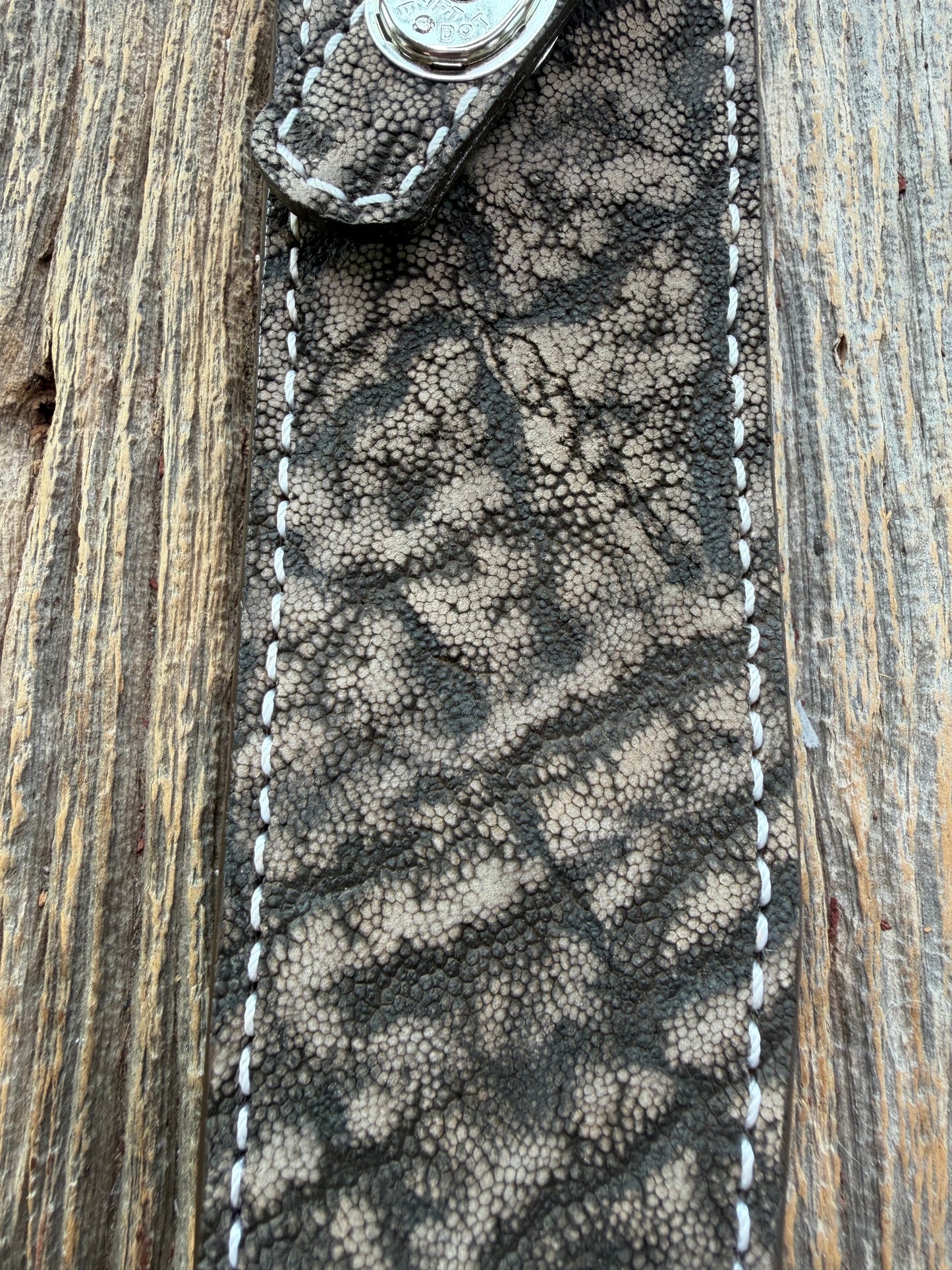 New Randall Model 1-8 Sheath in Exotic thick and textured Black and Grey Elephant Ear  on brown leather from Treeman with a silver Canteen snap. Hand tooled belt loop. Killer sheath.