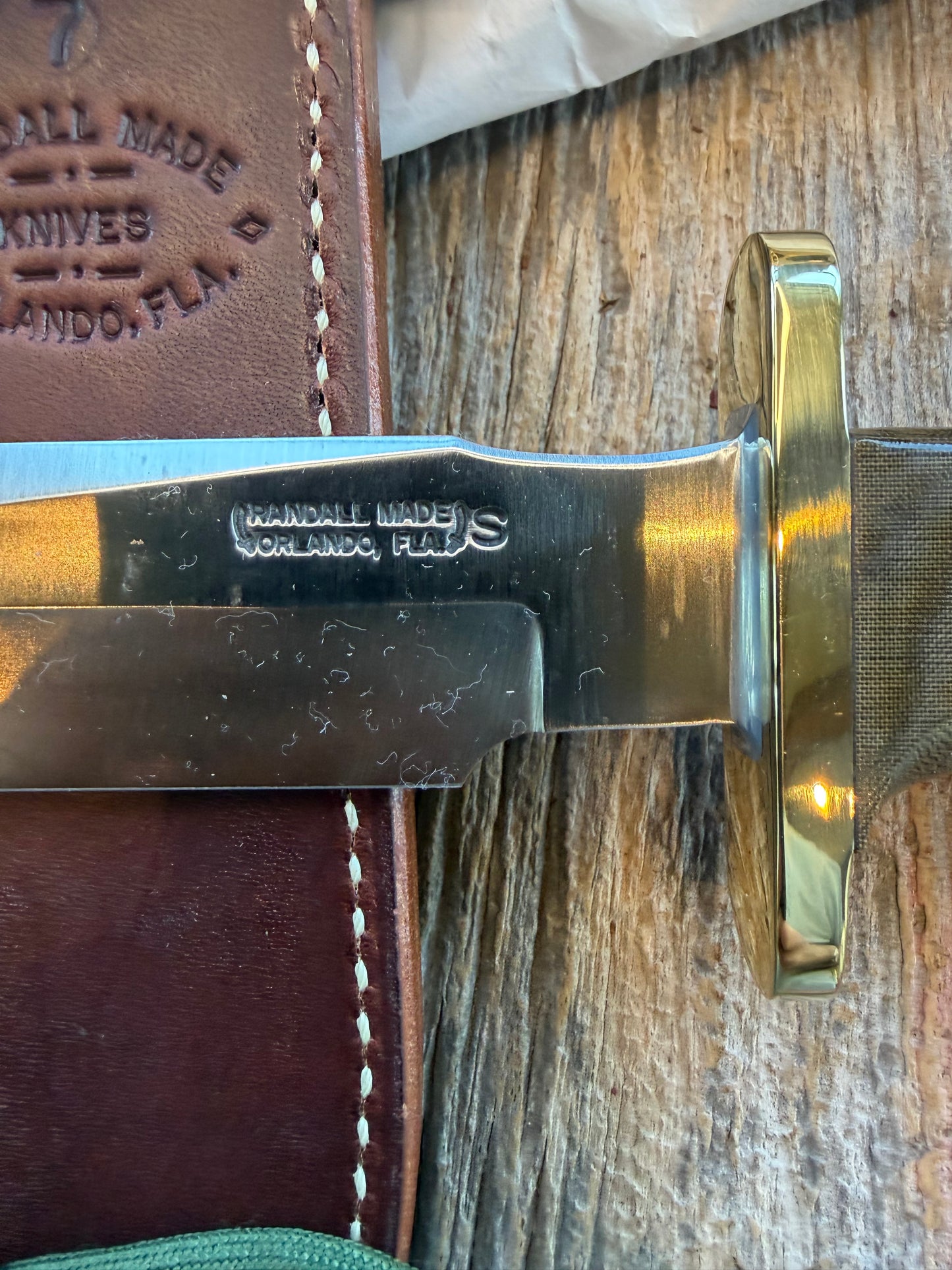 New in Paper Randall Model 16 SP#1 Special fighter with a Green Micarta handle. SS blade, Nickel silver hilt. Lanyard. Brown leather sheath.
