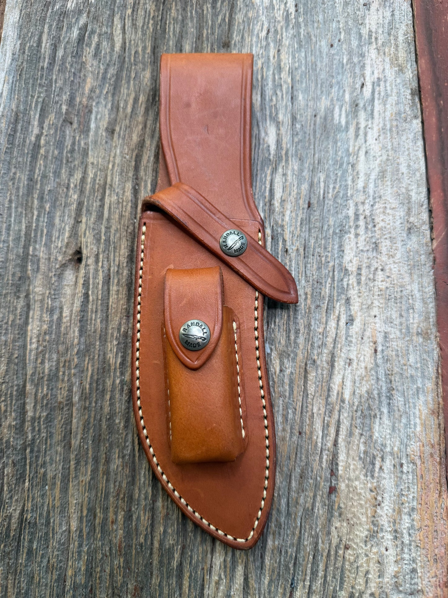 Randall by Gutcher Knife Sheath for a Model Rick Bowles Special.  Randall snaps, pouch with stone. Tuff sheath.