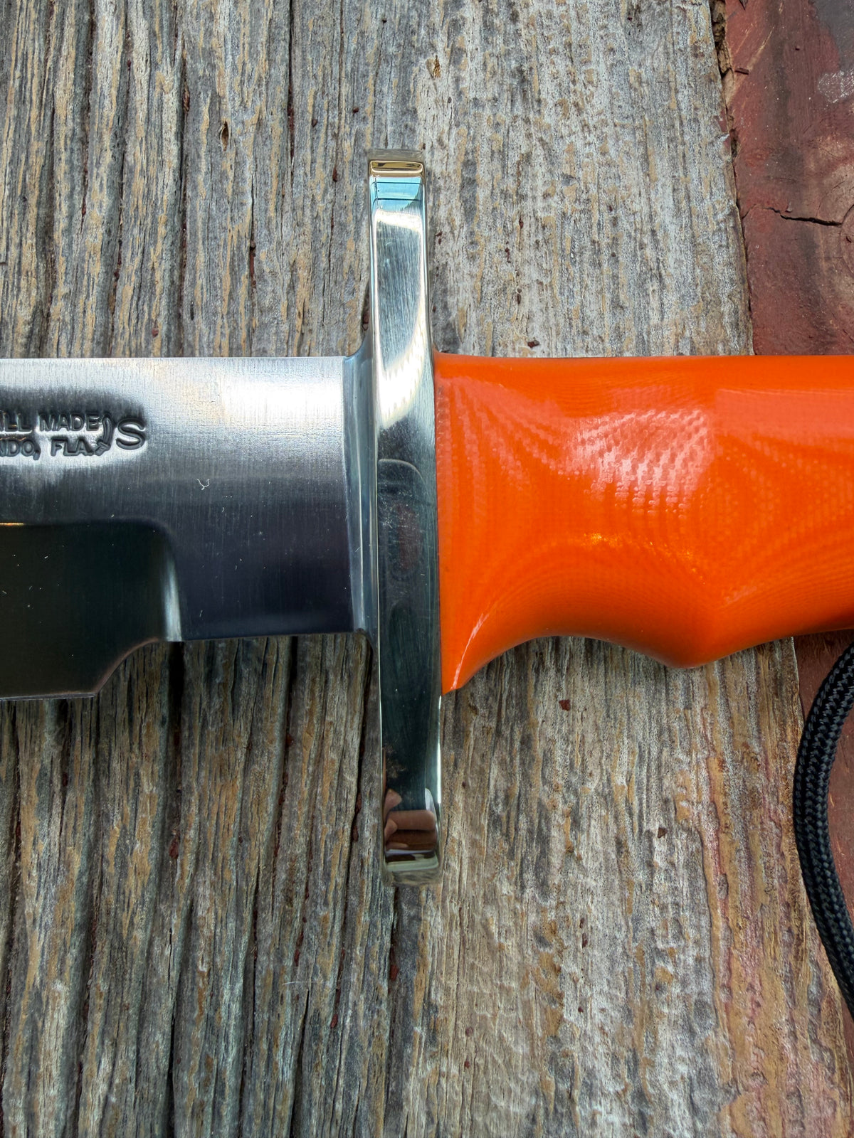 New in Paper Randall Model 14-7.5 with an Orange G10 Micarta Handle. Single Finger grip, SS, Black Sheath, Lanyard and Sawteeth.