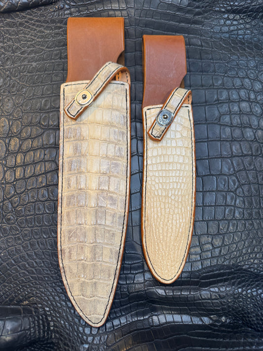 A pair of Randall Model 12-11 Large Sasquatch and Randall Model 12-8 Small Sasquatch Sheaths in Exotic Ivory Crocodile by Treeman.