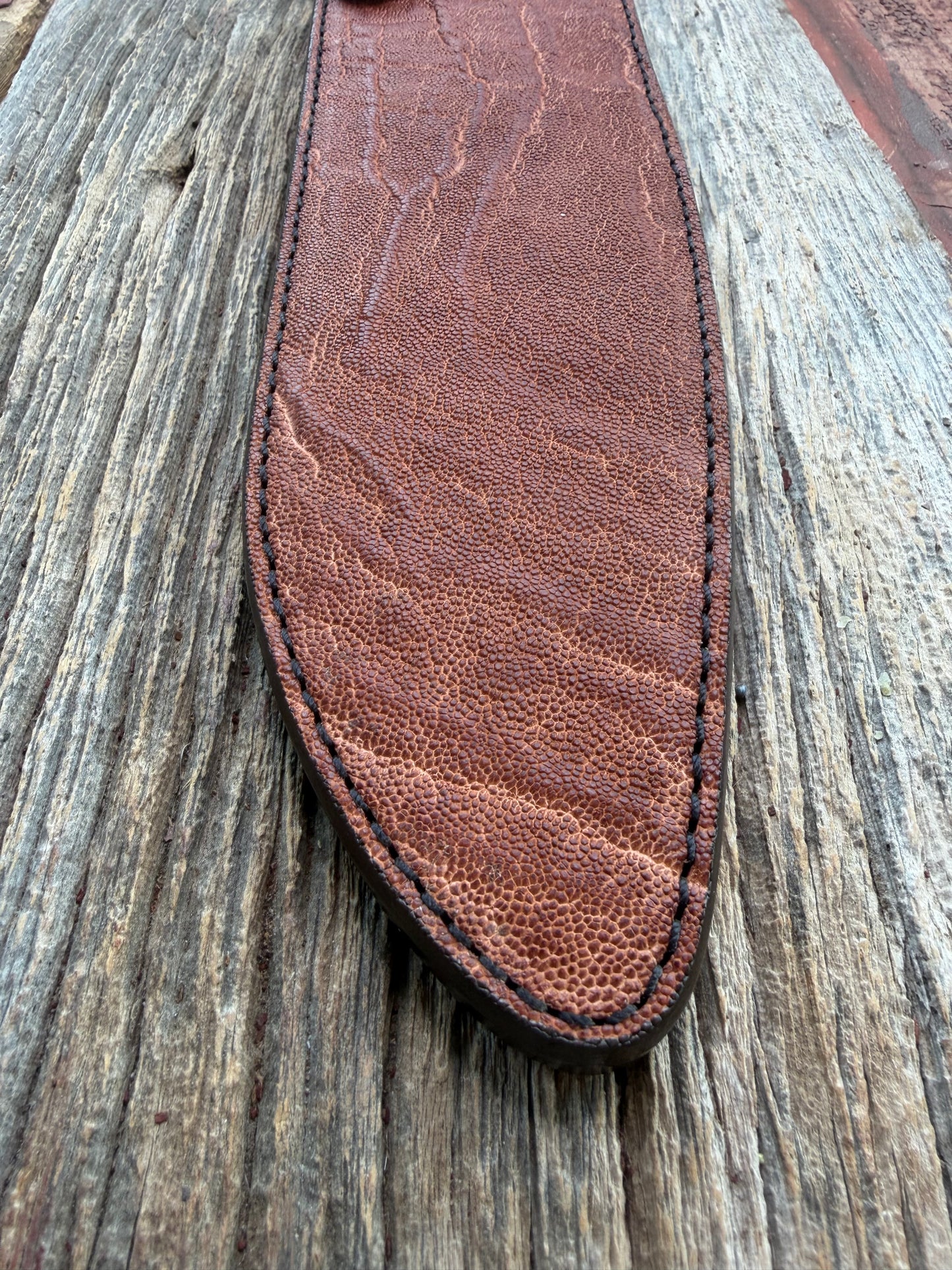 New Randall Model 12-11 Large Sasquatch Sheath in Exotic thick and textured Rust colored Elephant hide on brown leather from Treeman with a black Canteen snap. Hand tooled belt loop. Killer sheath.