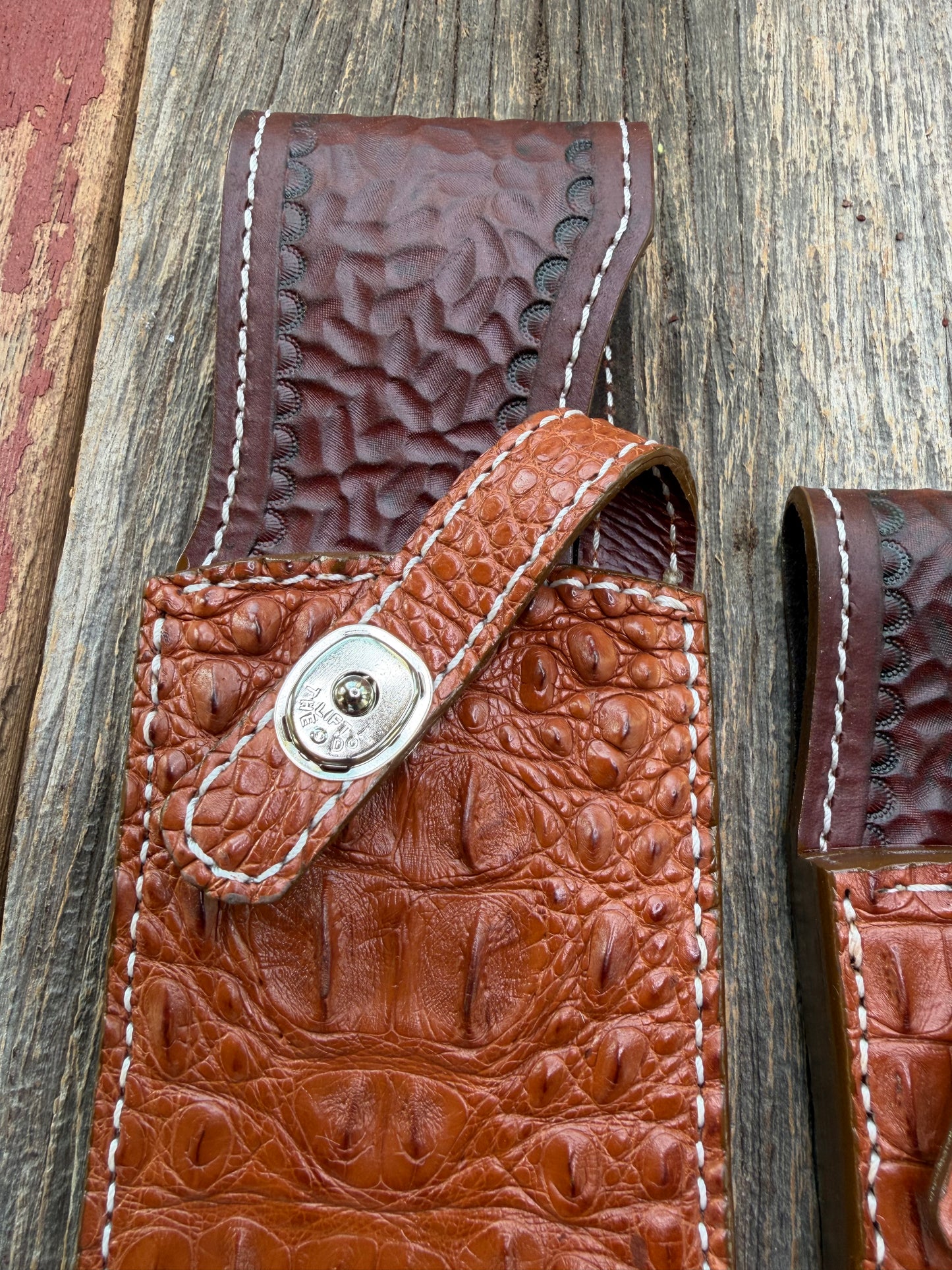 Pair of new Randall Model 12-11 Large and Small Sasquatch Sheaths in Exotic thick and textured Honey Crocodile skin ( skull portion) on brown leather from Treeman with a silver Canteen snap. Hand tooled belt loop. Killer sheath.