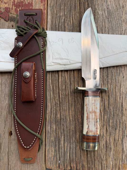 New in Paper Randall Model 12-9 Fossil Walrus Ivory and 25 style stacked Leather grip. Double Nickel Silver hilt and nickel butt cap.