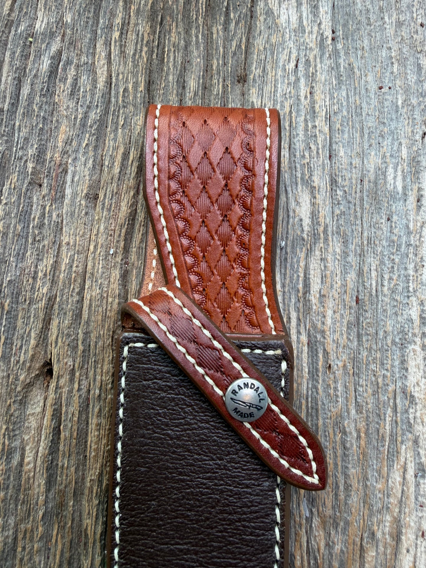 Pristine Randall Model 25-6 sheath in Exotic Cape Buffalo leather from Sullivans by Gutcher. Heavily tooled belt loop and strap. Randall snap and clean stamping on the back … perfect!!