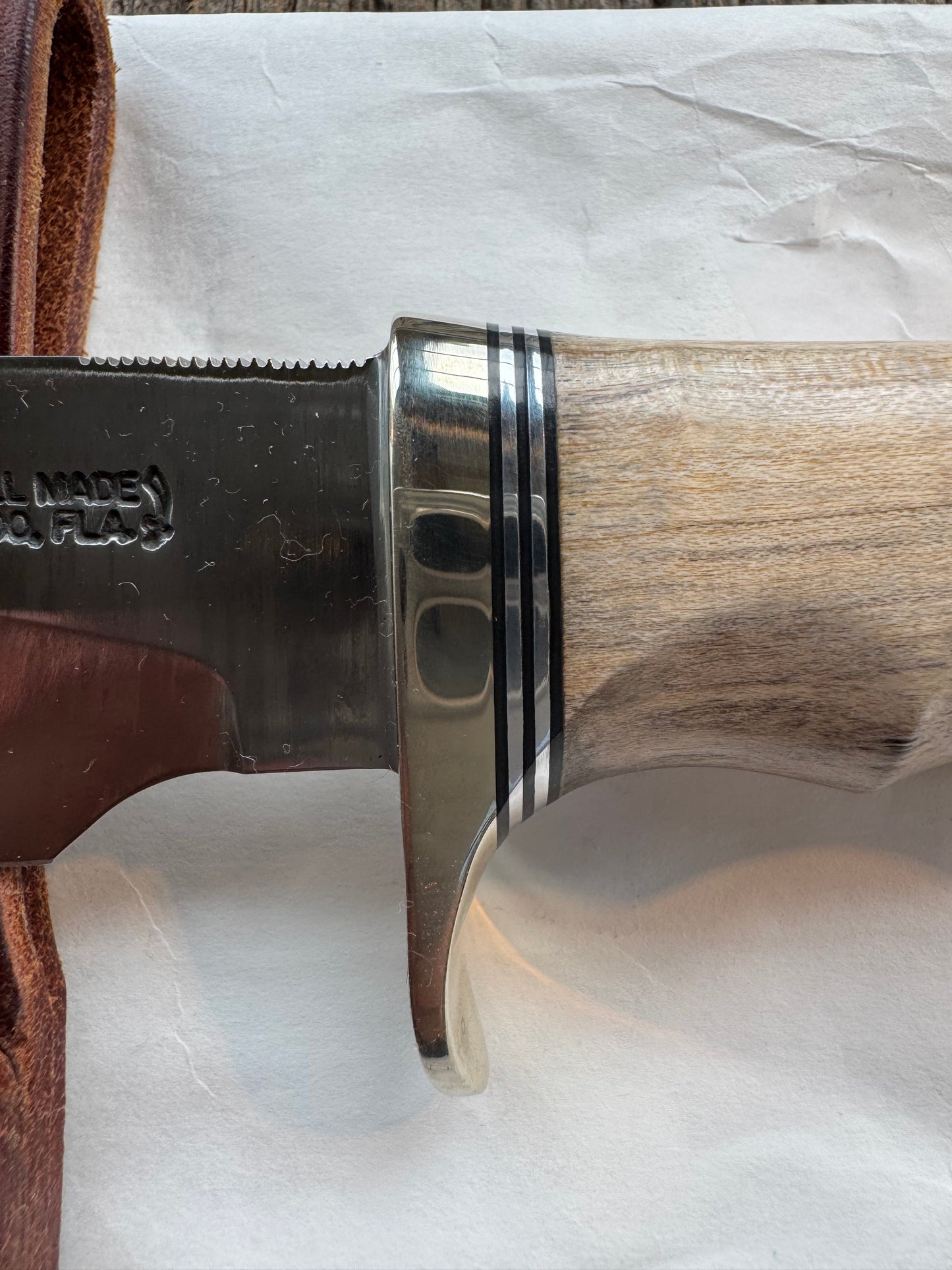 New in Paper Randall Non Catalog Model Sergeants Special, Maple handle with finger grooves. Carbon blade, Nickel silver single hilt and butt cap. Brown leather sheath.