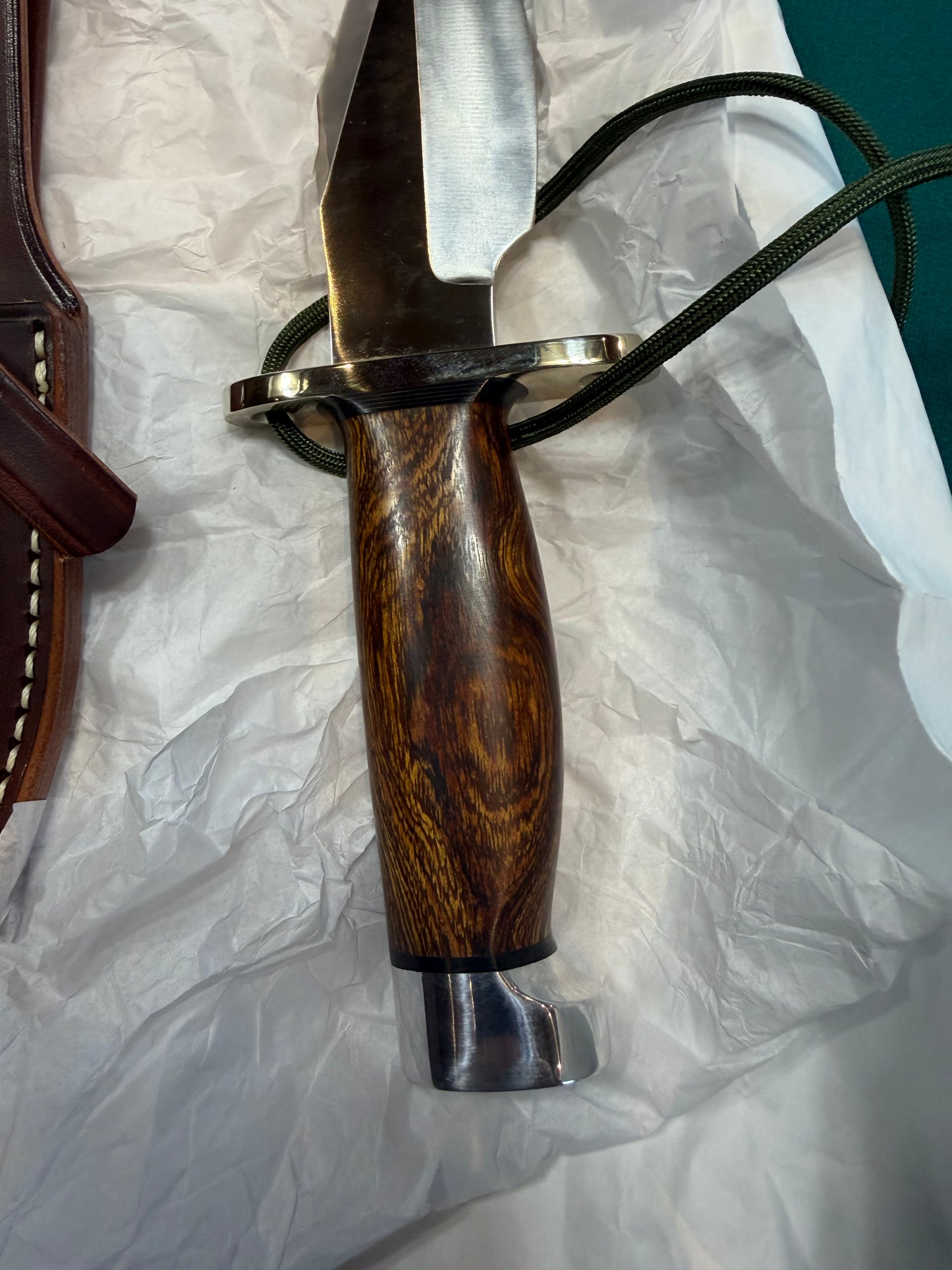 New in Paper Randall Model 19-5 with a nice piece of Ironwood. Nickel silver Hilt and Aluminum crows beak Butt cap.