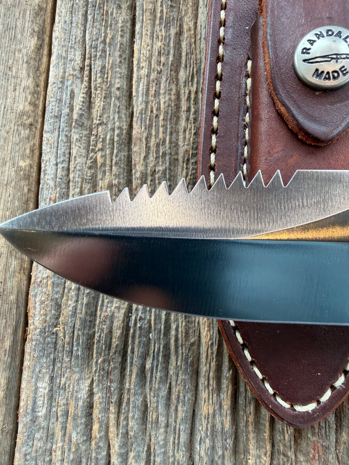 Randall Model Combat Companion with a nice piece of customer supplied Warthers Resin with finger grooves. Teeth, Nickel Silver Hilt and a raw natural end.