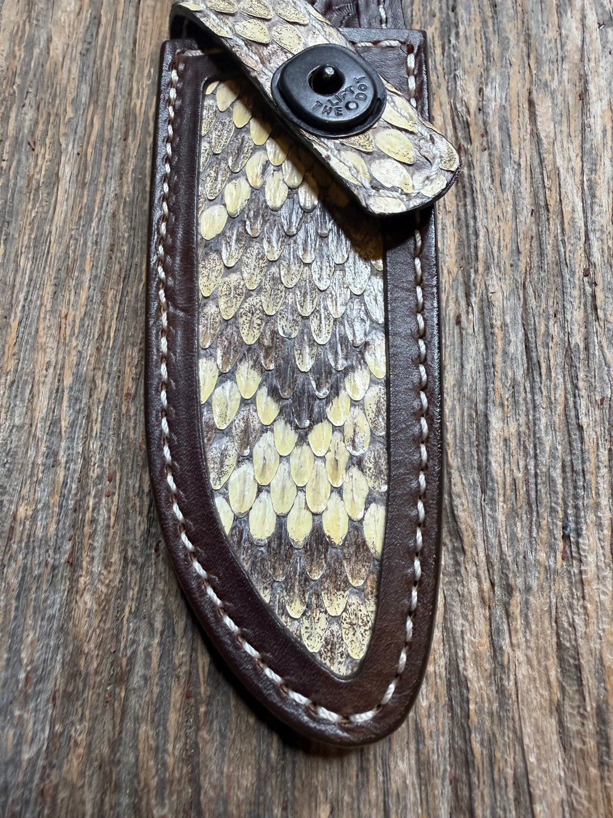 Randall Model 23 sheath with an Eastern Diamondback RattleSnake skin from Treeman Sheaths. Hand tooled belt loop, canteen snap. One the hardest skins to source.