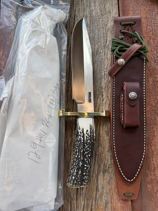 New in paper Randall Model 12-9/14 Grind Bowie with a Huge piece of Popcorn Stag. Brass Lugged Hilt and brass Butt plate.