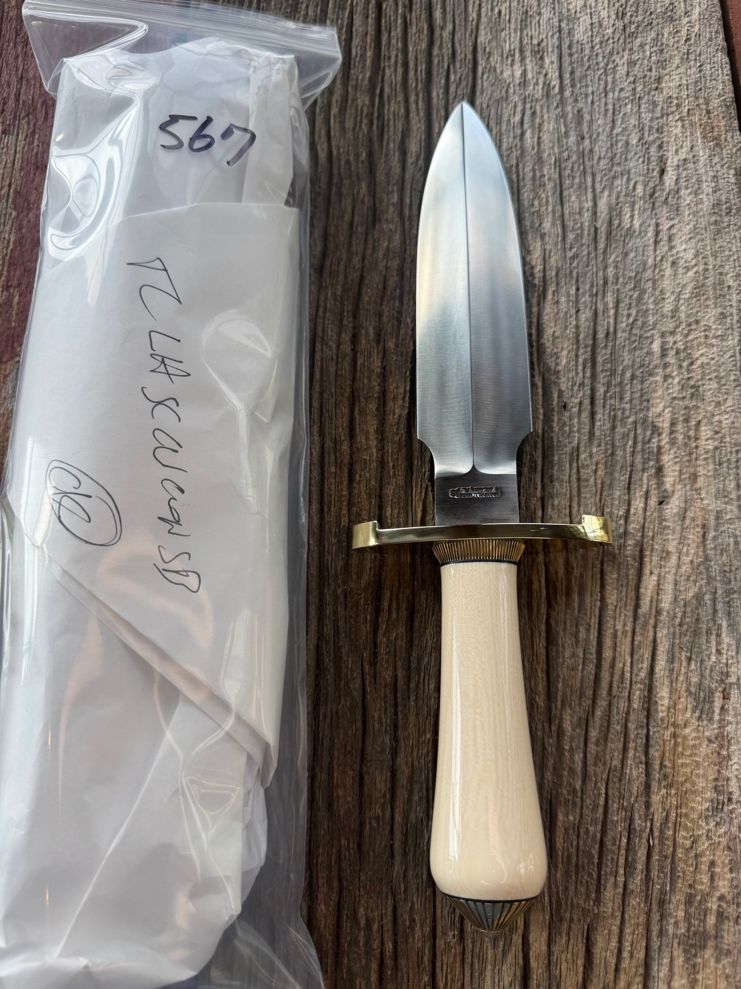 New in paper Randall Clinton Special with a nice piece of customer supplied Warthers Resin with concave grip, Stainless Steel, Brass Lugged Hilt and brass scalloped coolie cap.