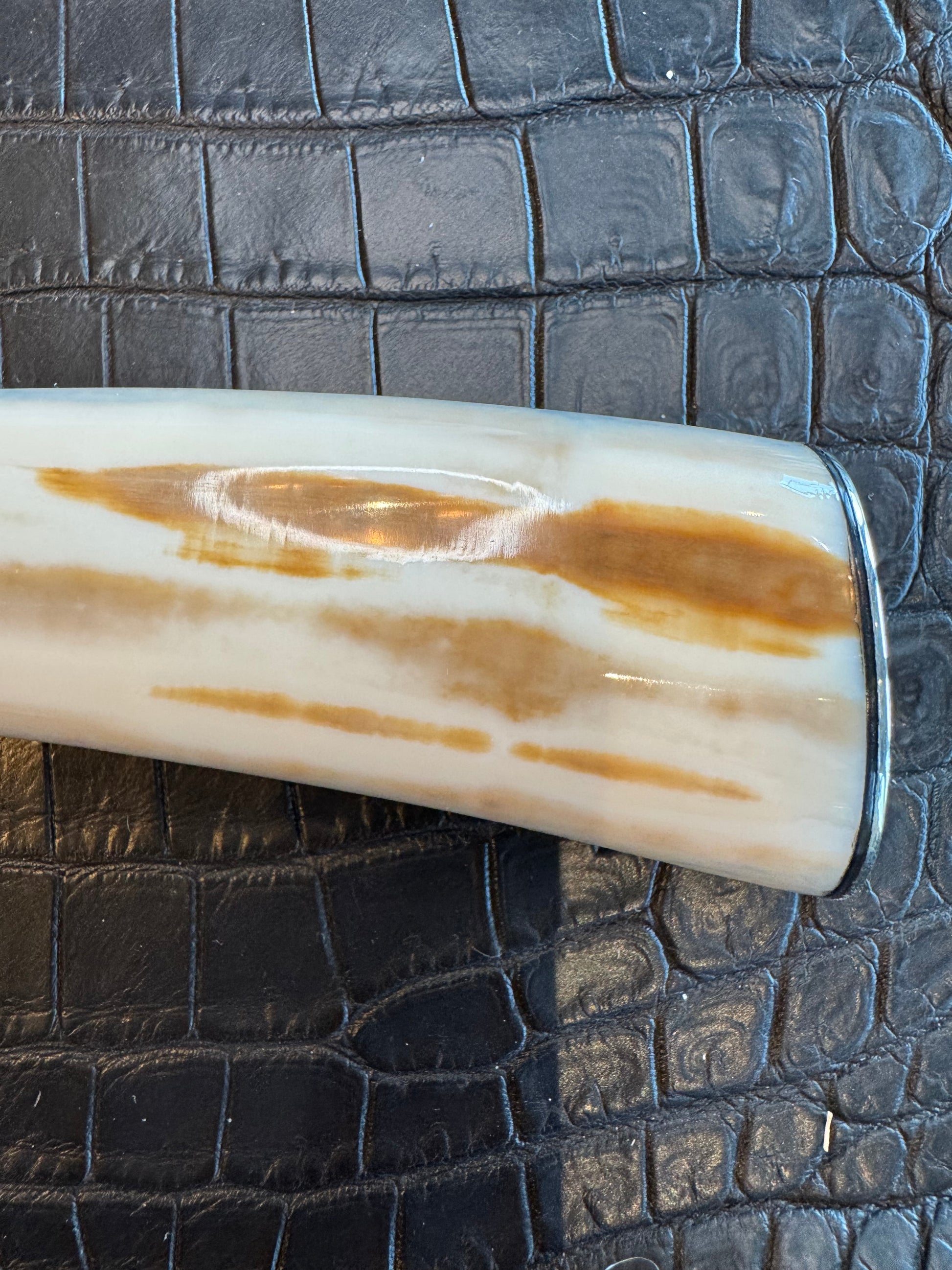 News in Paper Randall Model 8-4 in a gorgeous piece of Cream and Blue Fossil Walrus Ivory. Nickel Silver single hilt with a nickel Collar and butt cap.