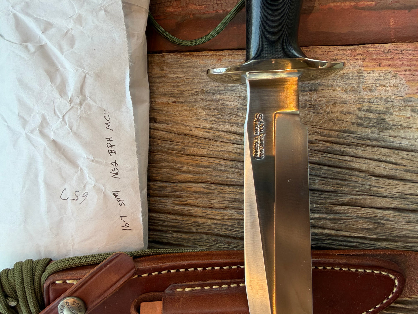 New in Paper Randall Model 16 SP#1 Special fighter with a Black Micarta handle. SS blade, Nickel silver Straight hilt. Lanyard. Brown leather sheath.
