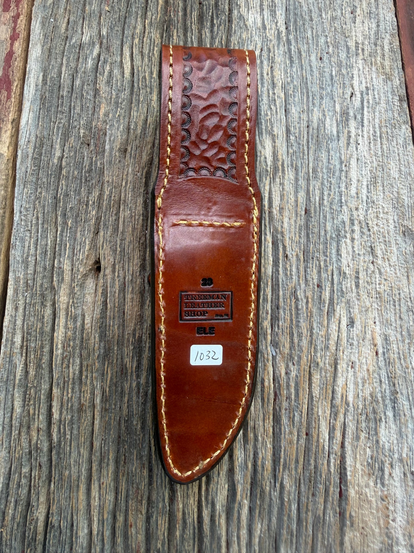 New Randall Model 23 Sheath in Exotic thick and textured Rust colored Elephant hide on brown leather from Treeman with a silver Canteen snap. Hand tooled belt loop. Killer sheath.
