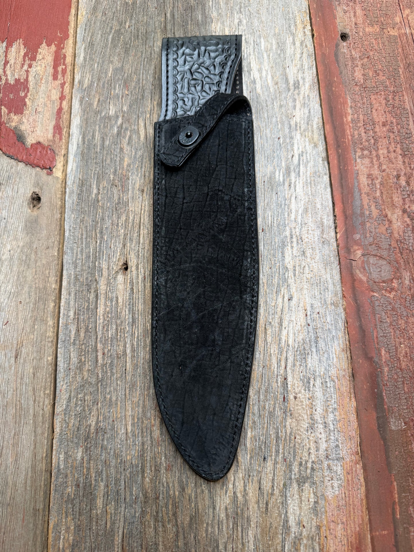 Randall Model 12-11 Large Sasquatch in Black Hippo, forward curved hilt, black Canteen Snap, full brass stamping and stitching.