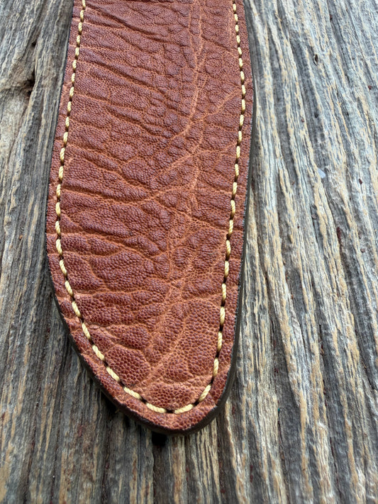 New Randall Model 1-7 Sheath in Exotic thick and textured Rust colored Elephant hide on brown leather from Treeman with a silver Canteen snap. Hand tooled belt loop. Killer sheath.