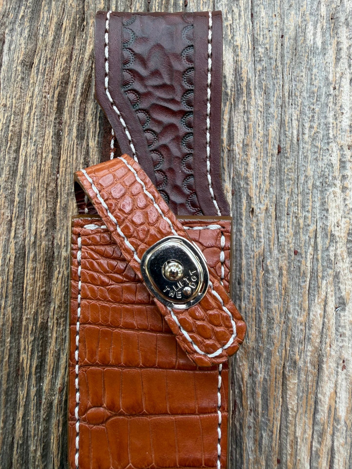 New Randall Model 23 Sheath in Exotic thick and textured Honey Crocodile skin on brown leather from Treeman with a silver Canteen snap. Hand tooled belt loop. Killer sheath.