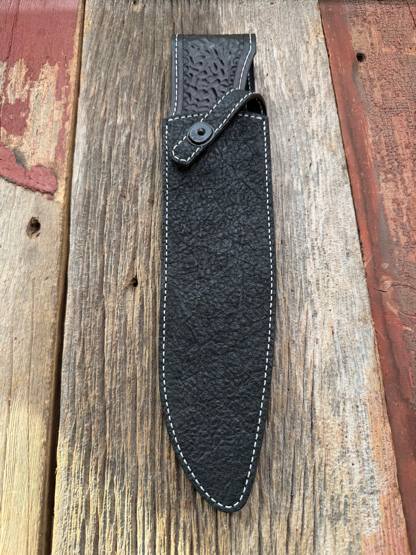 New Randall Model 12-11 Large Sasquatch Sheath in Exotic thick and textured Black Elephant hide on black leather from Treeman with a black Canteen snap. Hand tooled belt loop. Killer sheath.