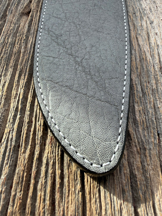 New Randall Model 12-11 Large Sasquatch Sheath in Exotic thick and textured Grey Elephant Hide on black leather from Treeman with a silver Canteen snap. Hand tooled belt loop. Killer sheath.