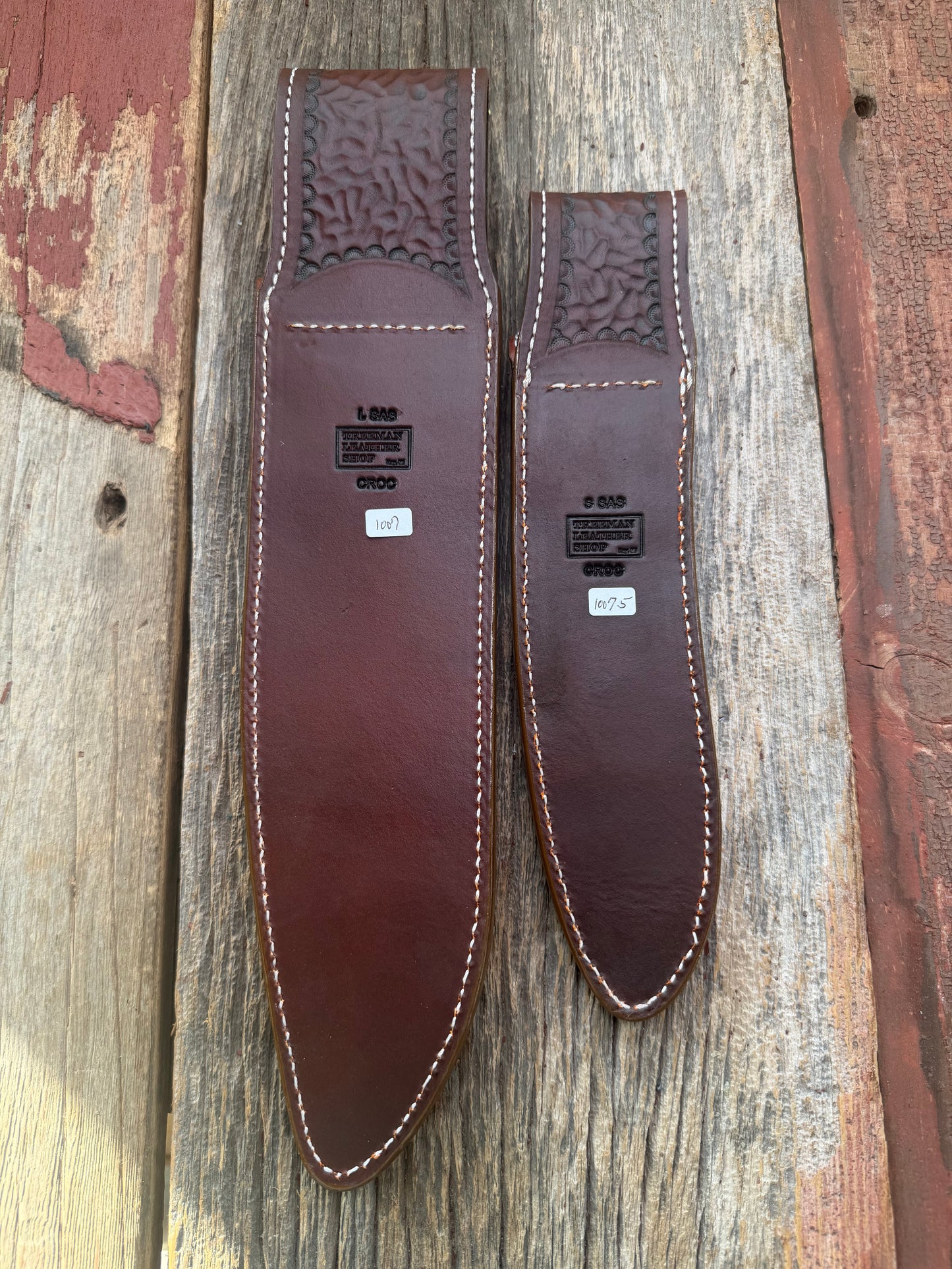Pair of new Randall Model 12-11 Large and Small Sasquatch Sheaths in Exotic thick and textured Honey Crocodile skin ( skull portion) on brown leather from Treeman with a silver Canteen snap. Hand tooled belt loop. Killer sheath.