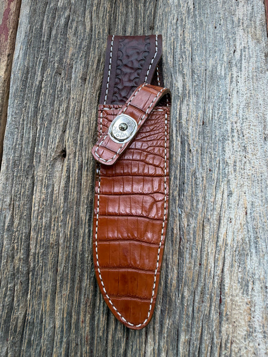 New Randall Model 1-6 Sheath in Exotic thick and textured Honey Crocodile skin on brown leather from Treeman with a silver Canteen snap. Hand tooled belt loop. Killer sheath.