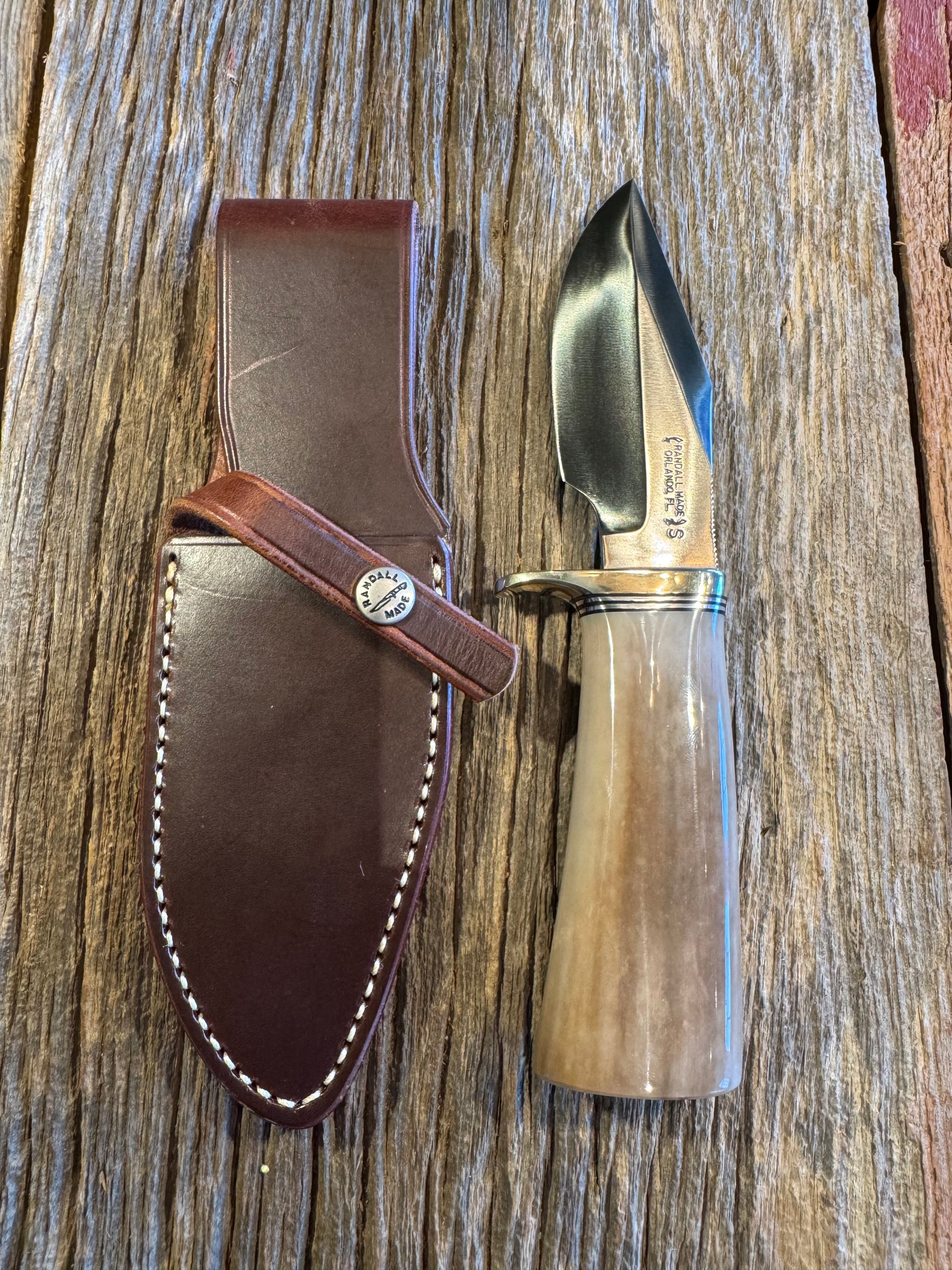Randall Model 19-4 in Beautiful Fossil Walrus Ivory. Gorgeous colors and very rare to see a 19 in FWI. Nickel Silver Single Hilt and natural end, SS, and Flawless