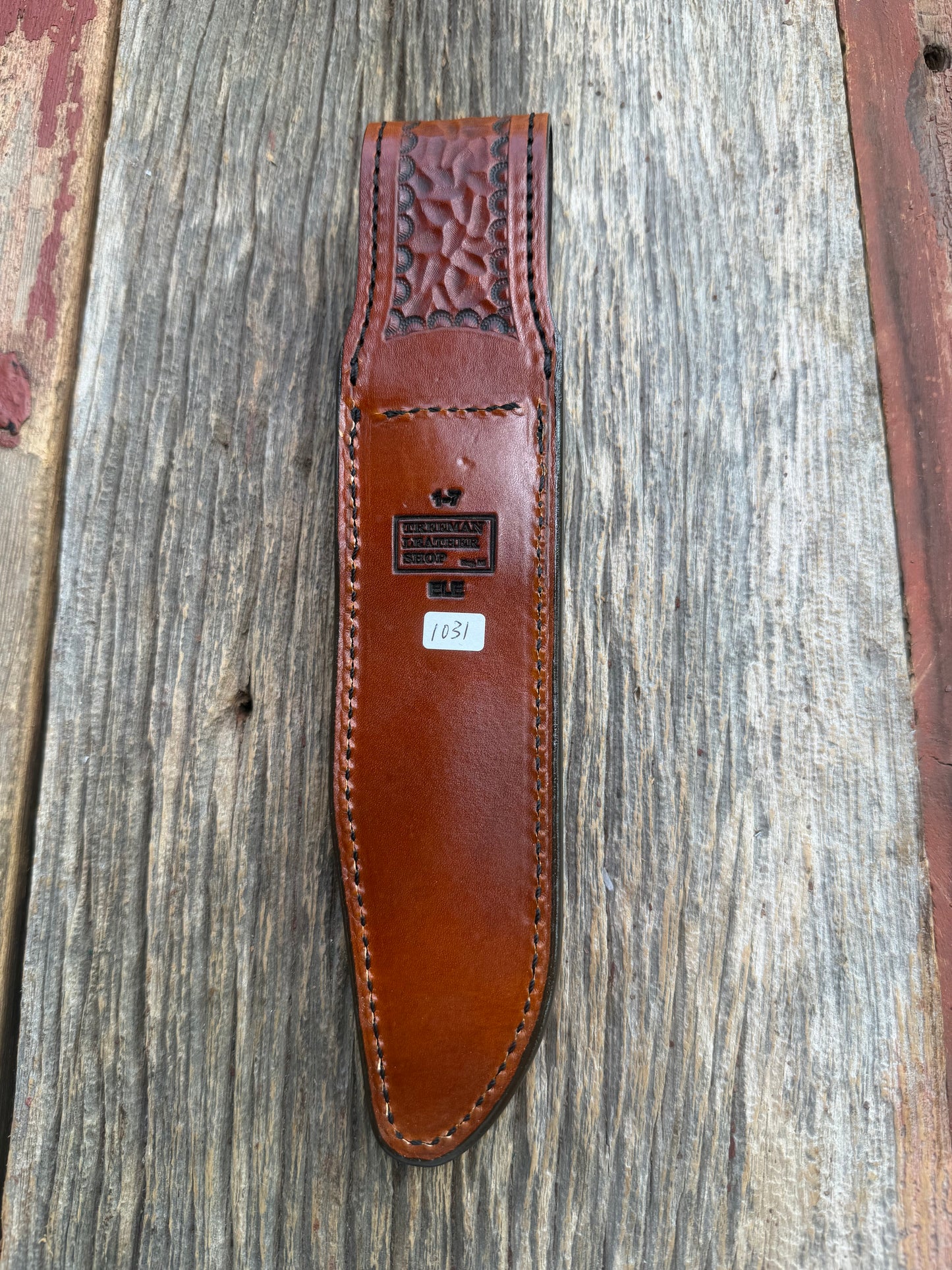 New Randall Model 1-7 Sheath in Exotic thick and textured Rust colored Elephant hide on brown leather from Treeman with a black Canteen snap. Hand tooled belt loop. Killer sheath.