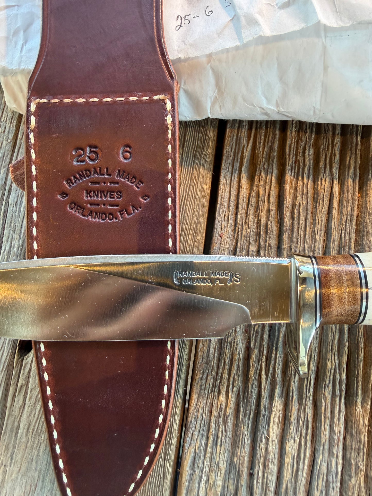 New in paper Randall Knife Model 25-6 Trapper in Stag Leather Handle Stainless Blade, NSH