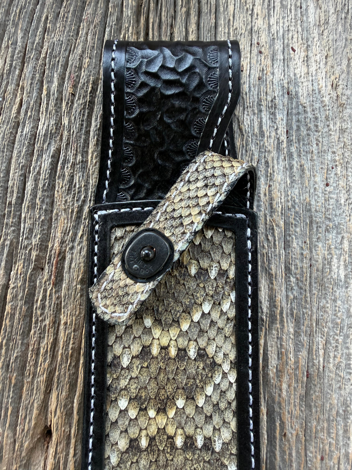Randall Model Confederate sheath with inlayed Western Diamondback RattleSnake skin from Treeman Sheaths. Very dark skin on brown leather, white deviated stitching and black canteen snaps.