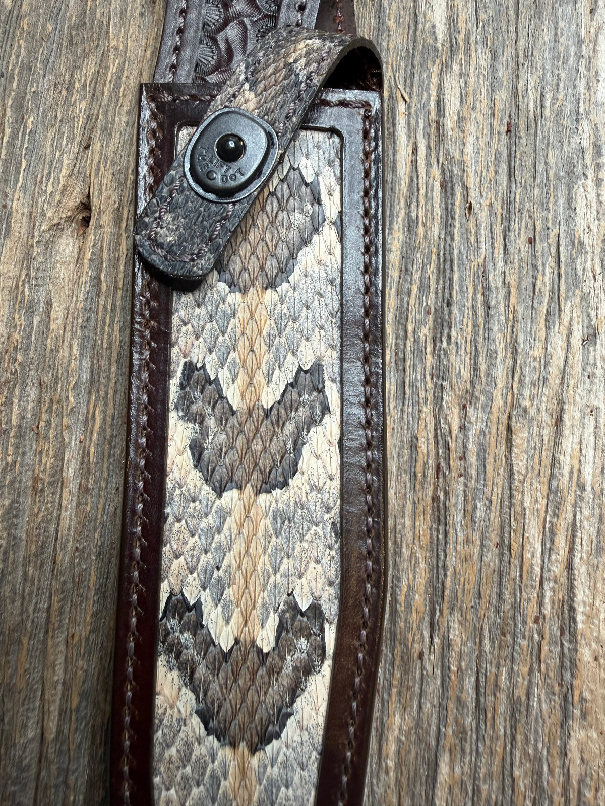 Randall Model 1-8 sheath with a Canebrake RattleSnake skin from Treeman Sheaths. Vibrant colors and along side Copperheads the hardest skin to source.