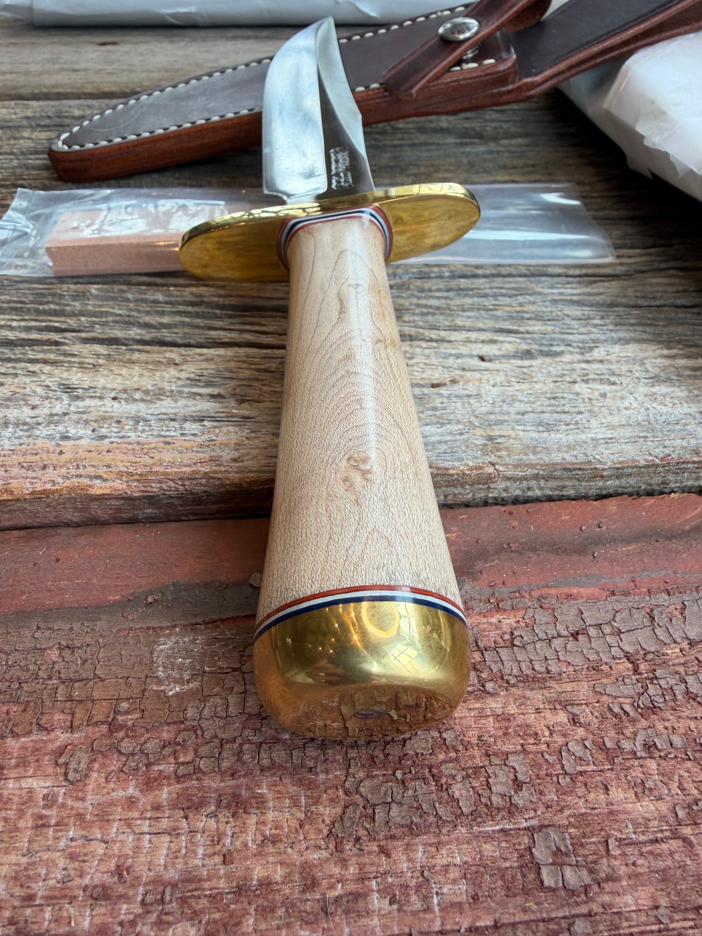 New Paper Randall Made Knife Model 12-6 supplied Maple handle, carbon  blade, brass hilt and rounded butt cap. Red white and blue spacers