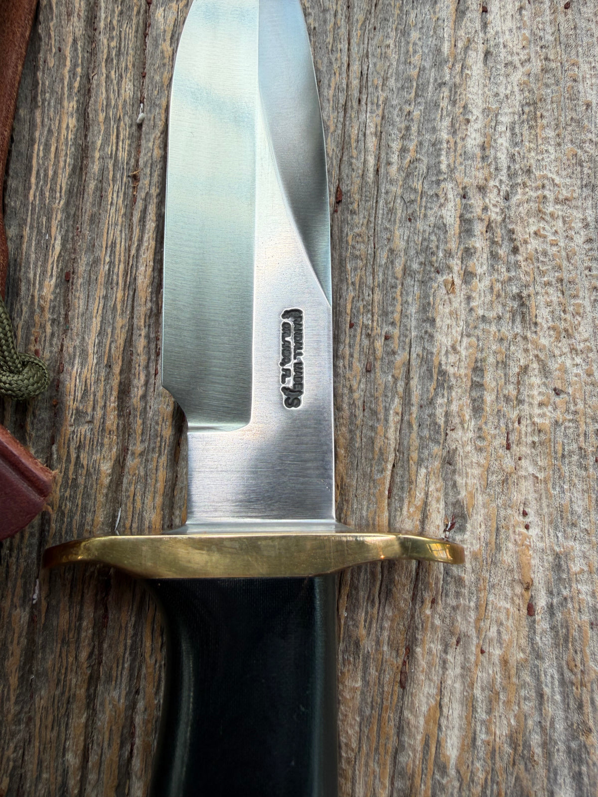 Nice Randall Model Combat Companion in Black Micarta. SS blade, brass hilt. Lanyard and paracord, Brown leather sheath.