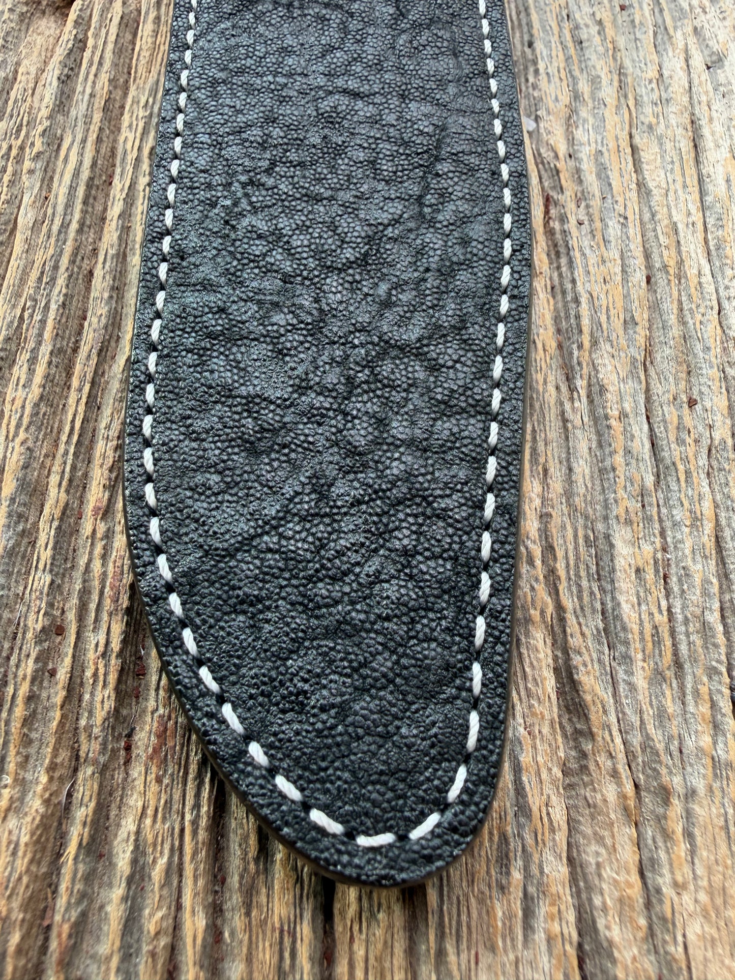 New Randall Model 1-7 Sheath in Exotic thick and textured Black Elephant hide on black leather from Treeman with a black Canteen snap. Hand tooled belt loop. Killer sheath.
