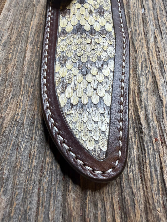 Randall Model 1-6 sheath with an Eastern Diamondback RattleSnake skin from Treeman Sheaths. Hand tooled belt loop, canteen snap. One the hardest skins to source.