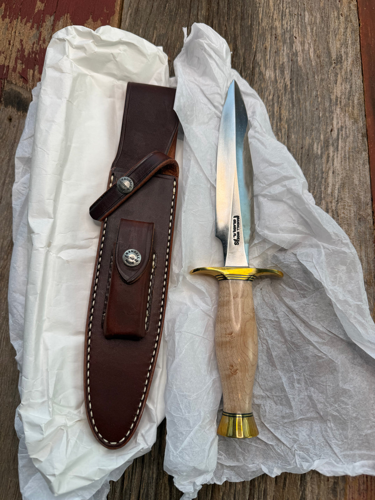 New in Paper Randall Made Knife Model 2-7 Maple wood, Stainless, Black and gold spacers, Brass Hilt and  butt cap.