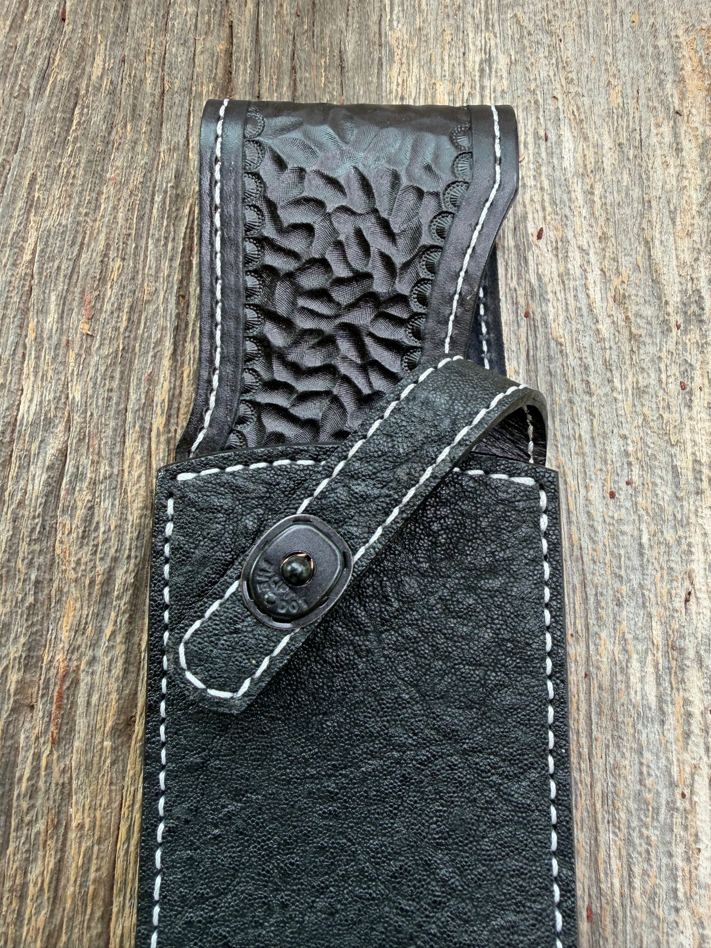 New Randall Model 12-11 Large Sasquatch Sheath in Exotic thick and textured Black Elephant hide on black leather from Treeman with a black Canteen snap. Hand tooled belt loop. Killer sheath.