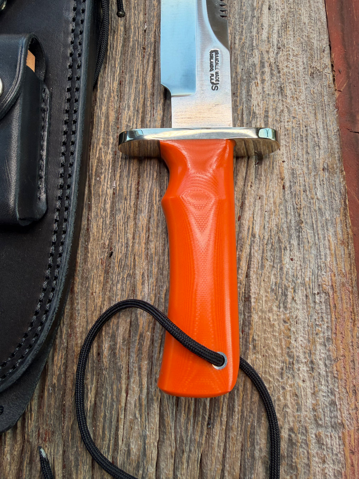 New in Paper Randall Model 14-7.5 with an Orange G10 Micarta Handle. Single Finger grip, SS, Black Sheath, Lanyard and Sawteeth.