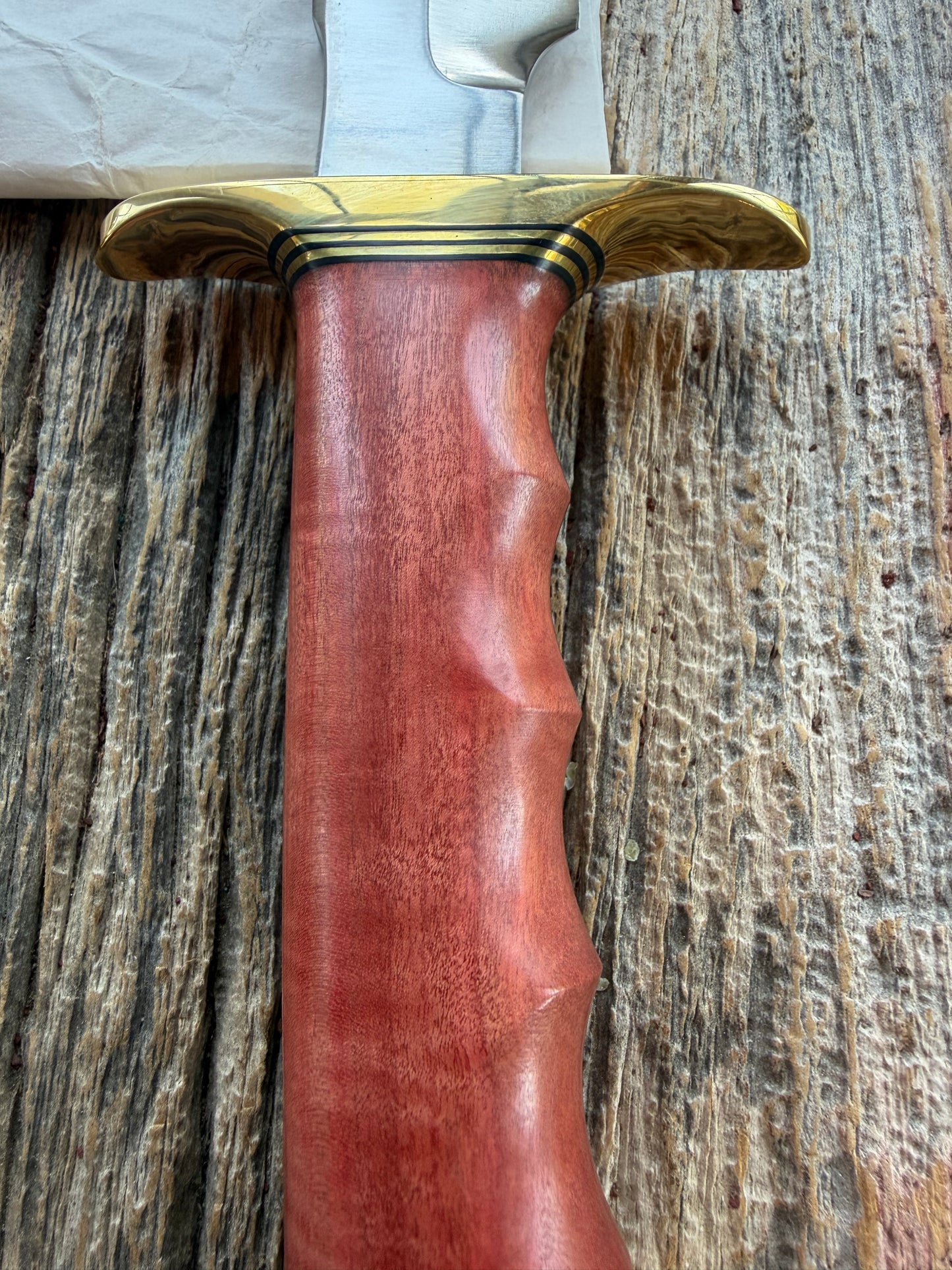 New in Paper Randall Made Knife Model 1-8 in Pink Ivory wood. Stainless steel, Black and Gold spacers, Brass Hilt and butt cap.