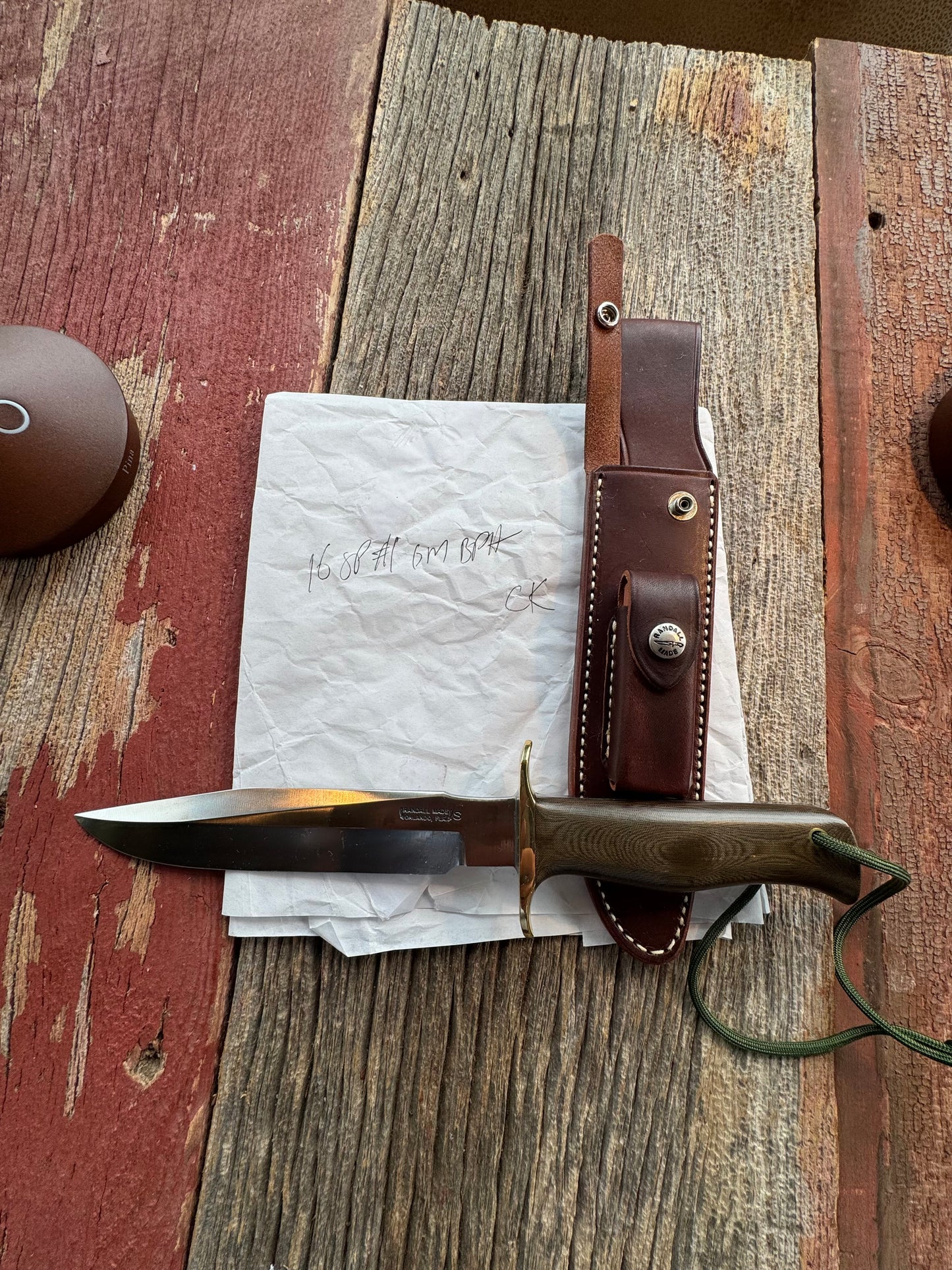 New in Paper Randall Model 16 SP#1 Special fighter with a Green Micarta handle. SS blade, Brass hilt. Lanyard. Brown leather sheath.