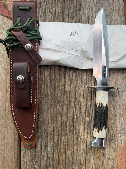 New in Paper Randall Made Knife Model 1-7 Stag , Stainless, Black and Aluminum spacers, Nickel Silver Hilt, Aluminum crows beak butt cap.