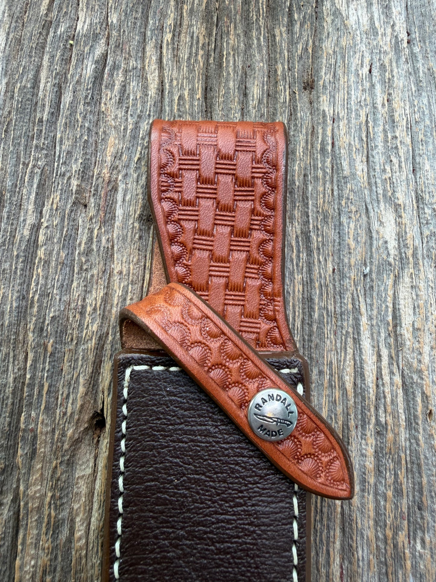 Pristine Randall Model 4-7 sheath in Exotic Cape Buffalo leather from Sullivans by Gutcher. Heavily tooled belt loop and strap. Randall snap and clean stamping on the back … perfect!!
