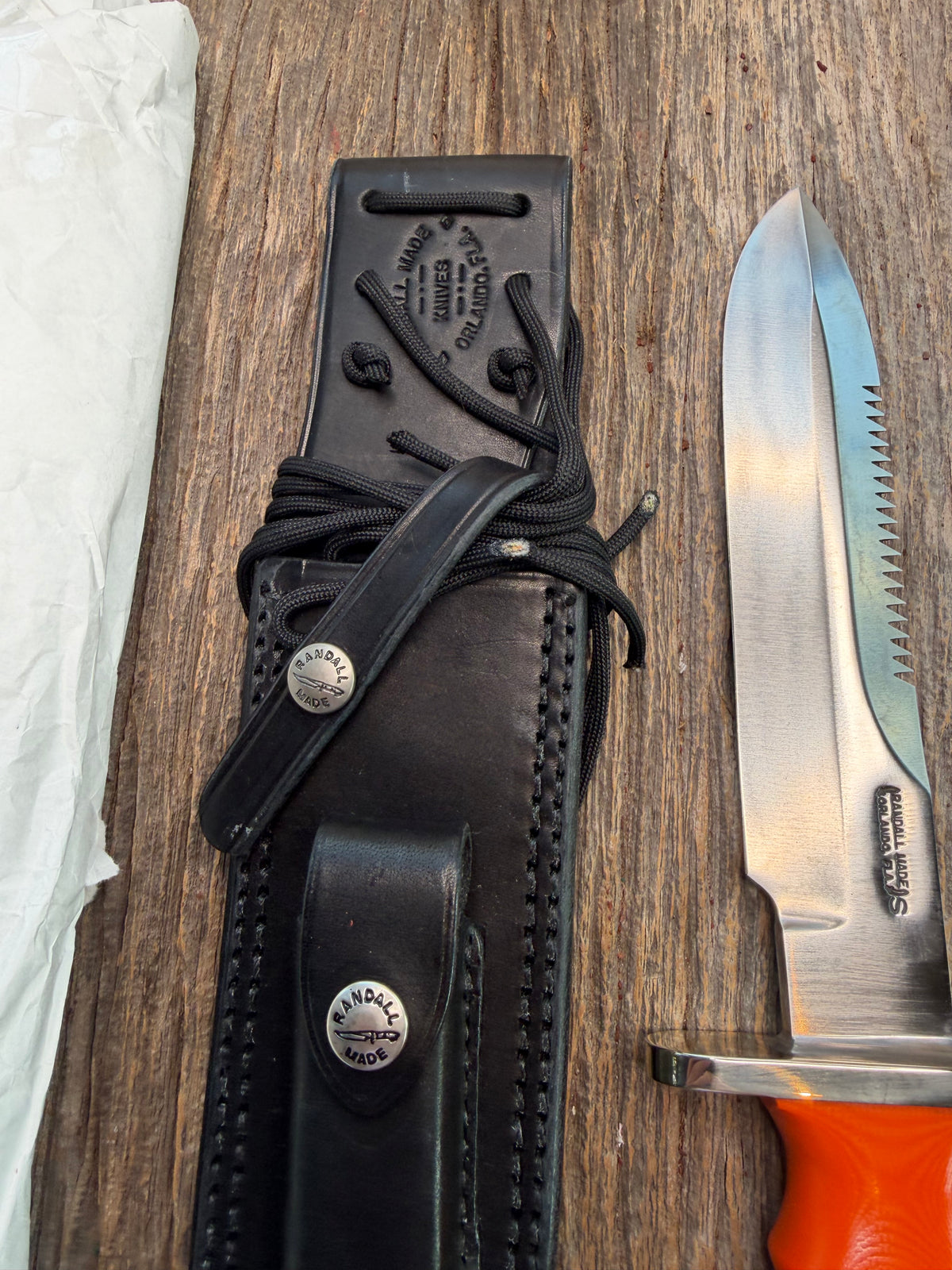 New in Paper Randall Model 14-7.5 with an Orange G10 Micarta Handle. Single Finger grip, SS, Black Sheath, Lanyard and Sawteeth.